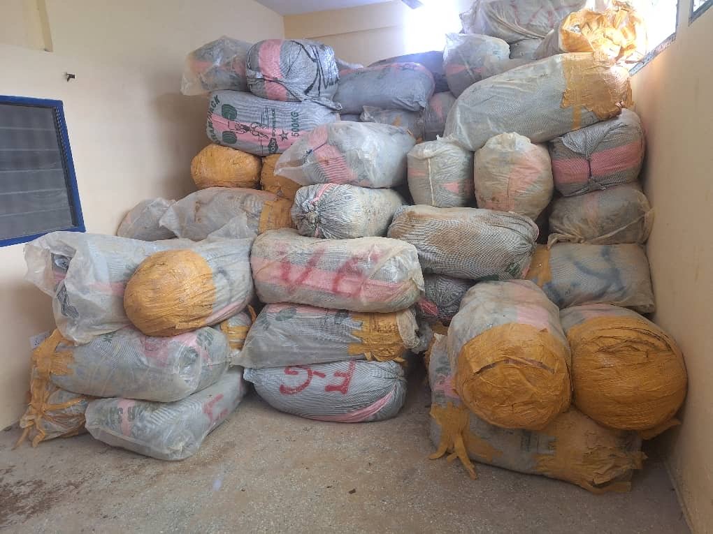 Tipper trucks intercepted with sacks of marijuana hidden under sand
