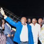Dr. Mahamudu Bawumia waving at the crowd at the Airport when he returned