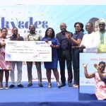Ernestina Sarfo (2nd left) and Leticia Adjei Twum (5th right) with officials of the bank and promo partners