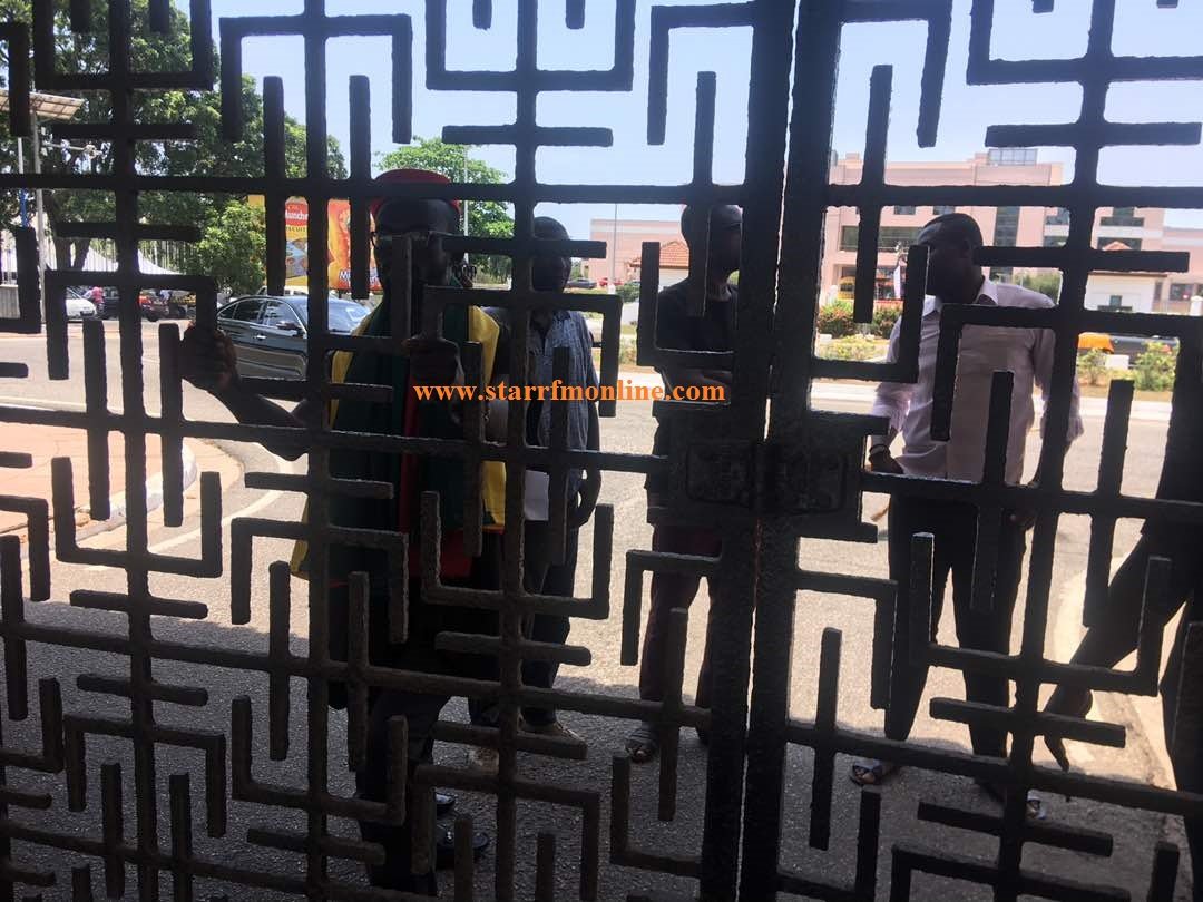 Members of the Economic Freedom Fighters stranded at the main gate of Parliament