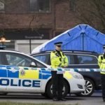 A forensic tent covers the area where the couple were found