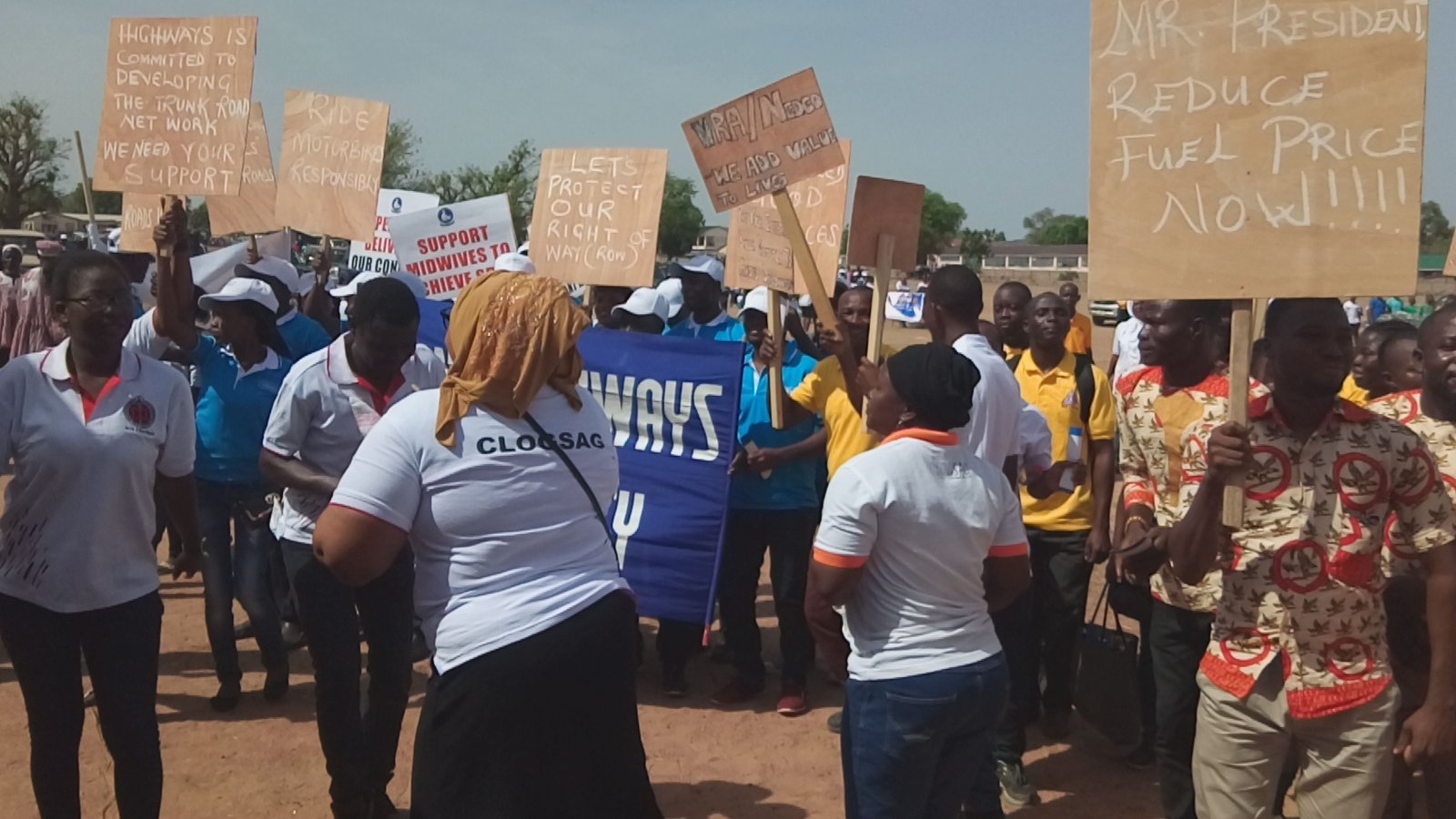 Workers displayed placards at the May Day celebration in Upper East