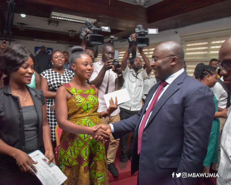 Bawumia in a handshake with one of the applicants