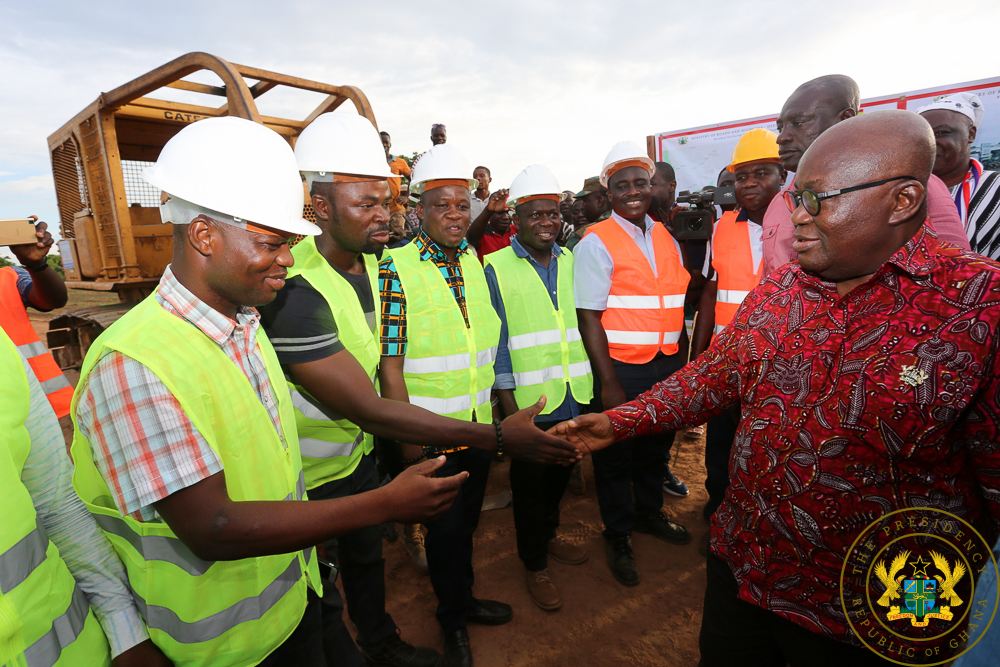 President Akufo-Addo exchanging pleasantries with workers at the site