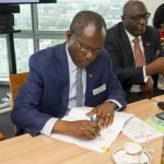Cocobod CEO Joseph Boahene Aidoo signing the deal