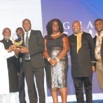 Mr. Samuel Koranteng being presented with GC100 plaque by the the Minister of Finance Ken Ofori-Atta