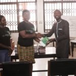 Officials of the Child Online Africa presenting the manual to the Library Authority