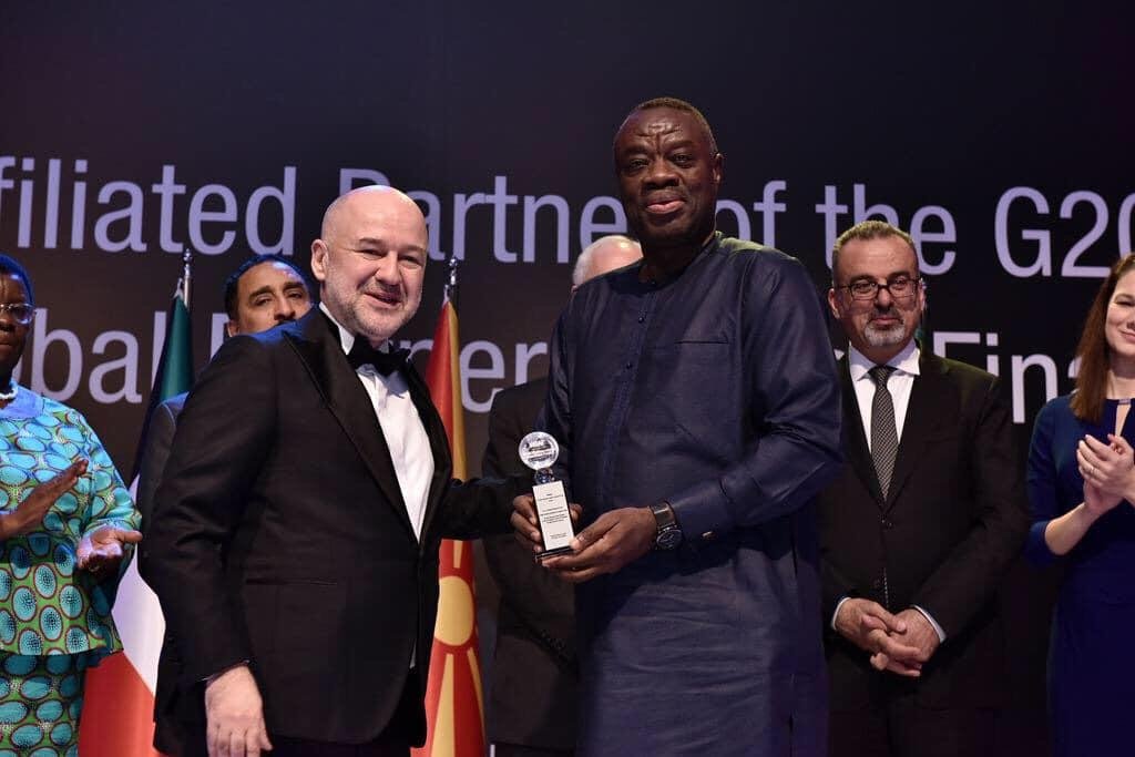 Awal Mohammed displaying the award