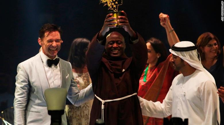 Kenyan teacher Peter Tabichi, center, actor Hugh Jackman, left, and Dubai crown prince Sheikh Hamdan bin Mohammed Al Maktoum react after Tabichi won the $1 million Global Teacher Prize in Dubai, United Arab Emirates.