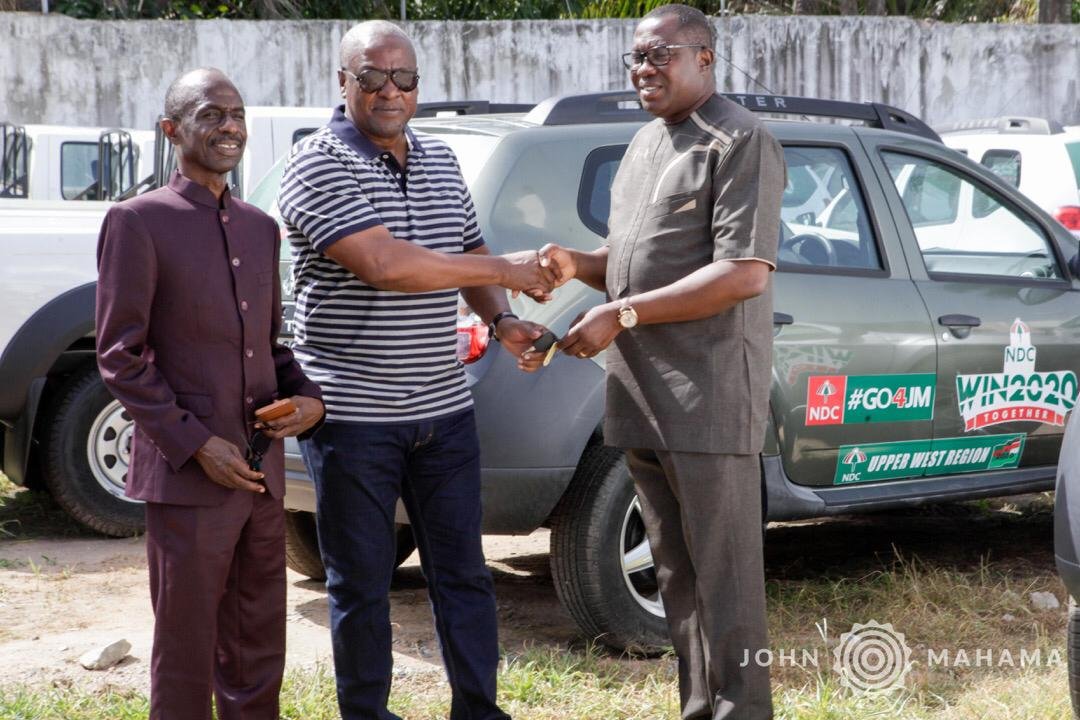 Mr. John Mahama presenting the vehicles to the leadership of the party
