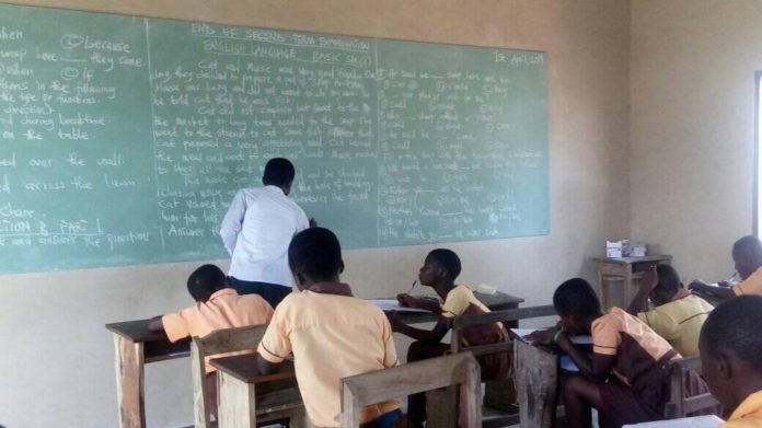 teacher writing on board