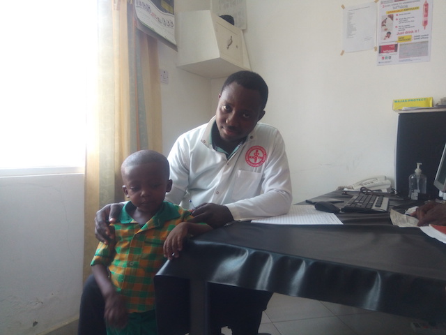 Toby Apomuta with Dr Moses Ofosu Amoako at Amiah Hospital in Bolgatanga