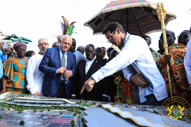 President being taken through the designs of Phase II of the Kumasi Central Market