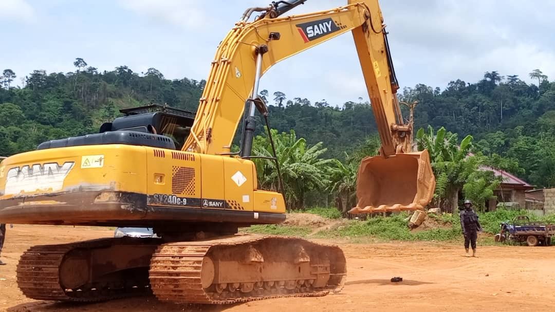 Seized excavator and trucks during National Security anti-galamsey operation in Ankaase
